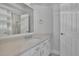Bathroom featuring a quartz countertop, white cabinets and modern fixtures at 5690 Rutland Trce, Lithonia, GA 30058