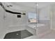 Stylish bathroom with a glass-enclosed shower and soaking tub, highlighted by elegant fixtures at 5690 Rutland Trce, Lithonia, GA 30058
