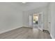 Light bedroom featuring double doors leading to an outdoor porch and neutral walls at 5690 Rutland Trce, Lithonia, GA 30058