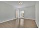 Bedroom showcasing hardwood floors and two large windows with natural light at 5690 Rutland Trce, Lithonia, GA 30058