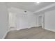 Bedroom features neutral walls and flooring, and a closet with white doors at 5690 Rutland Trce, Lithonia, GA 30058