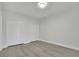 Empty bedroom with hardwood floors and a closet at 5690 Rutland Trce, Lithonia, GA 30058
