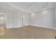 An empty bedroom is painted in neutral colors and features a tray ceiling at 5690 Rutland Trce, Lithonia, GA 30058