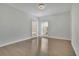 Bright, airy bedroom features gleaming hardwood floors and large windows at 5690 Rutland Trce, Lithonia, GA 30058