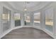 Light filled breakfast nook with large windows and modern chandelier at 5690 Rutland Trce, Lithonia, GA 30058