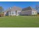 Charming single-Gathering home with manicured lawn and elegant architectural details at 5690 Rutland Trce, Lithonia, GA 30058