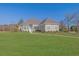 Inviting home with manicured lawn, showcasing a charming architectural design at 5690 Rutland Trce, Lithonia, GA 30058