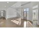 Elegant foyer featuring high ceilings, modern lighting, and gleaming hardwood floors at 5690 Rutland Trce, Lithonia, GA 30058