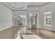 Grand foyer with high ceilings, elegant lighting, and hardwood floors creating a welcoming entrance at 5690 Rutland Trce, Lithonia, GA 30058