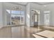 Bright foyer with high ceilings, decorative lighting, and beautiful hardwood flooring at 5690 Rutland Trce, Lithonia, GA 30058