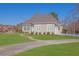 Beautiful single-story home featuring a gray roof, neutral siding, and a well-manicured lawn at 5690 Rutland Trce, Lithonia, GA 30058