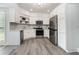 Well-equipped kitchen featuring white cabinetry, stainless steel appliances, and ample countertop space for meal preparation at 5690 Rutland Trce, Lithonia, GA 30058