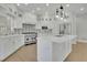 Spacious kitchen with stainless steel appliances, center island, and modern lighting at 5690 Rutland Trce, Lithonia, GA 30058
