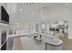 Bright living room featuring high ceilings, fireplace, and seamless flow to a modern kitchen at 5690 Rutland Trce, Lithonia, GA 30058