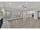 Bright living room with fireplace, hardwood floors, and views of the backyard at 5690 Rutland Trce, Lithonia, GA 30058