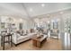 Inviting living room with hardwood floors, a fireplace, and an open layout flowing into the kitchen and dining areas at 5690 Rutland Trce, Lithonia, GA 30058