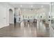 Spacious living room with hardwood floors, high ceilings, large windows, and an open layout perfect for entertaining at 5690 Rutland Trce, Lithonia, GA 30058