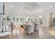 Elegant living room showcasing vaulted ceilings, a stone fireplace, hardwood floors, and a seamless connection to the kitchen at 5690 Rutland Trce, Lithonia, GA 30058