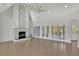 Bright living room features fireplace, cathedral ceilings, large windows, and hardwood floors that enhance the appeal at 5690 Rutland Trce, Lithonia, GA 30058