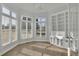 Bright office space with built-in shelves and multiple windows offering ample natural light at 5690 Rutland Trce, Lithonia, GA 30058