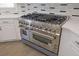 Close up of stainless steel ZLINE stove with double oven and a grill at 5690 Rutland Trce, Lithonia, GA 30058