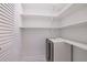 Walk-in pantry with custom shelving and a stainless steel beverage cooler at 5690 Rutland Trce, Lithonia, GA 30058