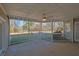 Covered patio with ceiling fan overlooking the backyard and surrounding landscape at 5690 Rutland Trce, Lithonia, GA 30058