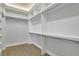 Large walk-in closet with custom shelving at 5690 Rutland Trce, Lithonia, GA 30058