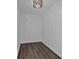 Closet featuring hardwood floors and modern lighting at 620 Peachtree Ne St # 1613, Atlanta, GA 30308