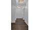 Hallway featuring hardwood floors and modern lighting at 620 Peachtree Ne St # 1613, Atlanta, GA 30308