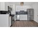 Modern kitchen featuring stainless steel appliances and stylish backsplash at 620 Peachtree Ne St # 1613, Atlanta, GA 30308