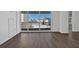 Bright living room with hardwood floors and balcony access with city views at 620 Peachtree Ne St # 1613, Atlanta, GA 30308