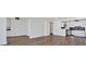 Bright living room featuring hardwood floors and a seamless open floor plan to the kitchen at 620 Peachtree Ne St # 1613, Atlanta, GA 30308