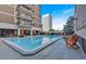 Beautiful swimming pool with lounge chairs and umbrellas, offering a serene escape with city views and relaxation at 620 Peachtree Ne St # 1613, Atlanta, GA 30308