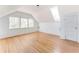 Bright attic room featuring hardwood floors, a skylight, and ample space at 629 Hansell Se St, Atlanta, GA 30312