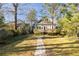 Charming home with a beautifully landscaped backyard featuring a stone path at 629 Hansell Se St, Atlanta, GA 30312