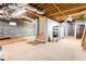 Unfinished basement with concrete walls, ductwork and wooden supports along the ceiling at 629 Hansell Se St, Atlanta, GA 30312