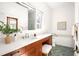 Bathroom featuring a vanity with wooden cabinets, white countertop, and tile flooring, offering style and functionality at 629 Hansell Se St, Atlanta, GA 30312