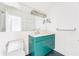 This bathroom features a modern vanity with a light green cabinet and a large, bright mirror at 629 Hansell Se St, Atlanta, GA 30312