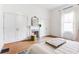 Bright bedroom with hardwood floors, fireplace, white closets, and natural light at 629 Hansell Se St, Atlanta, GA 30312