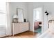 Bedroom featuring decorative cabinet and ensuite bathroom with patterned tile flooring at 629 Hansell Se St, Atlanta, GA 30312