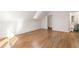 Bright bedroom featuring hardwood floors, a skylight, and access to a bathroom at 629 Hansell Se St, Atlanta, GA 30312