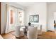 Bright breakfast nook featuring a glass table, seating for four, and hardwood flooring at 629 Hansell Se St, Atlanta, GA 30312