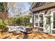 Deck with outdoor sofa, plants, and view of backyard at 629 Hansell Se St, Atlanta, GA 30312