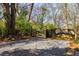 Gravel driveway with a view of the wooded area at 629 Hansell Se St, Atlanta, GA 30312