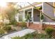 Cozy home exterior featuring charming front porch and walkway at 629 Hansell Se St, Atlanta, GA 30312