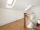 Hallway with skylights, offering a bright and open space with hardwood flooring at 629 Hansell Se St, Atlanta, GA 30312