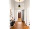 Hallway with hardwood floors, a decorative table and stylish lighting at 629 Hansell Se St, Atlanta, GA 30312