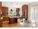 Modern kitchen with custom wood cabinetry, a large island, and a dining table with seating at 629 Hansell Se St, Atlanta, GA 30312