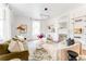 Bright living room with hardwood floors, fireplace, modern light fixture and stylish decor at 629 Hansell Se St, Atlanta, GA 30312